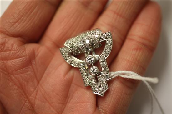 A 1930s Art Deco white gold and diamond set clip brooch, approx. 1in.